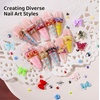 image:imageFAMDAMEI 24 Grid Nail Charms Nail Art Kit with Multi Shapes Bedazzling Gems for Nails Flatback AB Nail Rhinestones Nail Pearls Y2K Cute Nail Charms 3D Hawaii Flowers Nail Jewels for Nail Designblue mermaid starfishred pink gemcolorful butterfly