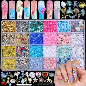 image:imageFAMDAMEI 24 Grid Nail Charms Nail Art Kit with Multi Shapes Bedazzling Gems for Nails Flatback AB Nail Rhinestones Nail Pearls Y2K Cute Nail Charms 3D Hawaii Flowers Nail Jewels for Nail Designgold pearls shellswhite AB pearls starfishblue gems